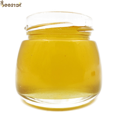 kopen Pure rauwe honing Natuur Fruitwood Flower Honing Geen verslavende stof Heldergele kleur 100% Natuurlijke Bijenhoning online vervaardiging