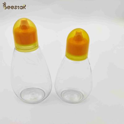 kopen 250ml 350ml 500ml Honey Jar And Spoon Plastic Leeg Honey Bottles voor honingsopslag online vervaardiging