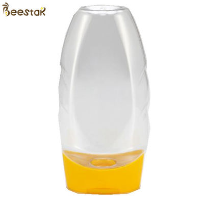 kopen Plastic de Fabrieksprijs Speciaal Plastic Leeg Honey Jar And Spoon 335ml van de voedselrang online vervaardiging