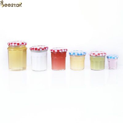 kopen de Mond van 150ml 200ml 250ml 380ml Honey Jar And Spoon Wide met het Dunne Deksel van het Schroefmetaal online vervaardiging